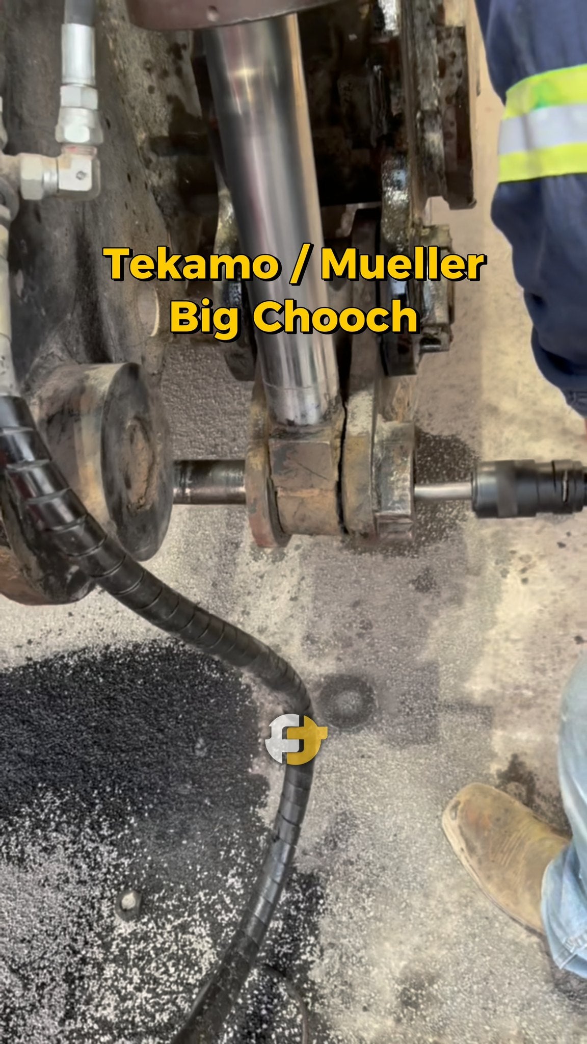 Close-up of a hydraulic machine being repaired using the Big Chooch air hammer.