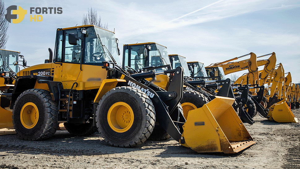 A heavy equipment fleet made of Komatsu wheel loaders and excavators