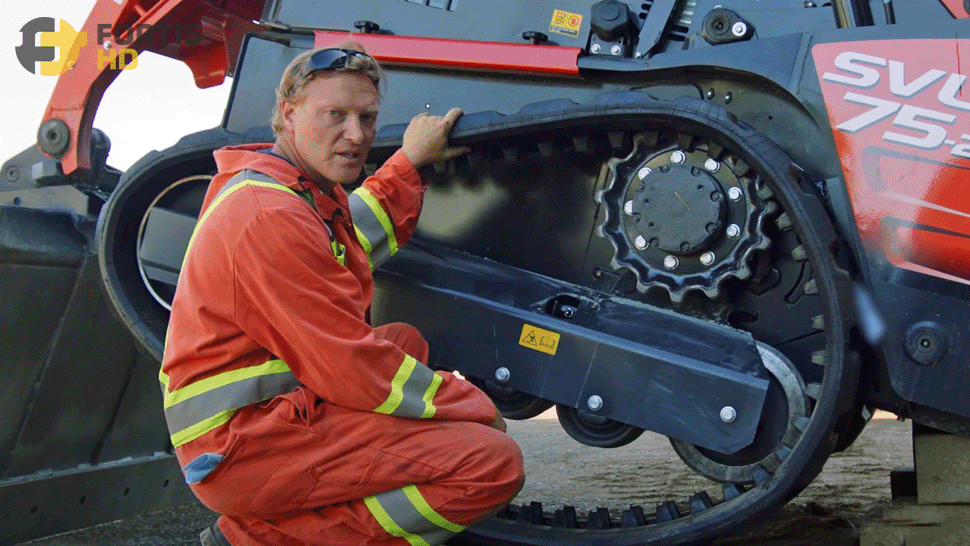Heavy-duty mechanic shows how to replace the rubber tracks on a Kubota SVL75-2 compact track loader_