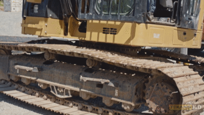 Demonstrating how to lift an excavator up to be able to access the track