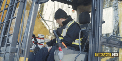 Heavy-duty-mechanic-testing-out-the-new-ignition-switch-on-a-komatsu-excavator