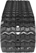 Rubber track with zig-zag tread pattern.