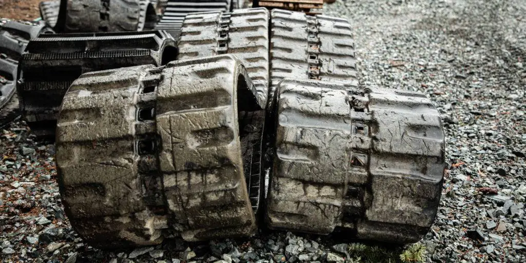 Damaged rubber tracks from heavy duty equipment