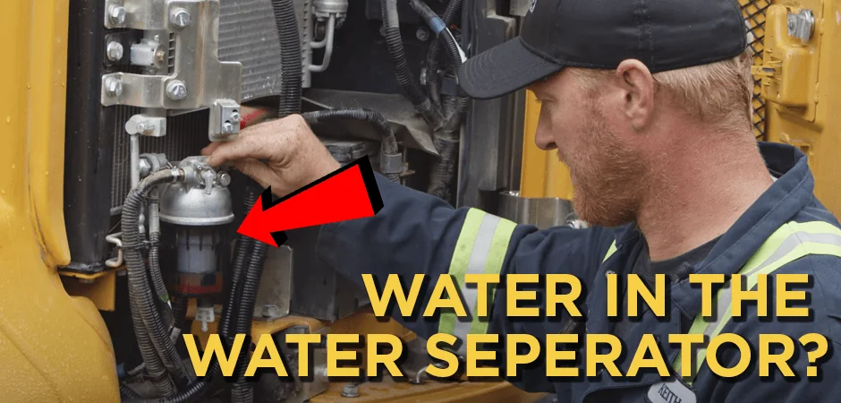Heavy equipment mechanic shows where to find the water separator in an excavator