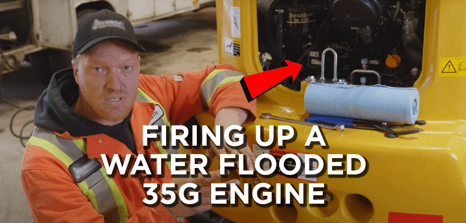 HD mechanic sitting next to mini excavator with text overlay saying “Firing up a water-flooded 35G engine