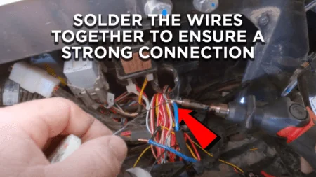 GPS installer is soldering the wires