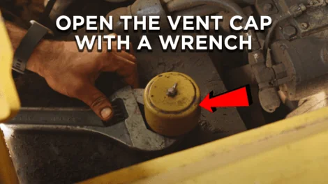 Opening the vent cap with a wrench