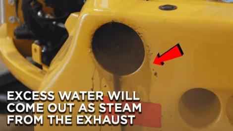 Excess water coming out as steam from the exhaust of a John Deere 35G Engine