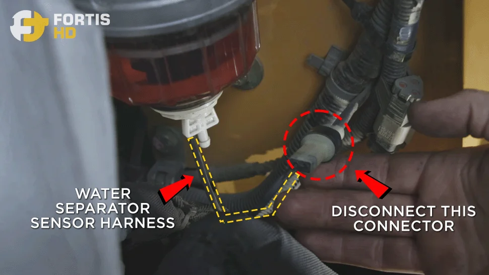 Arrows pointing at the fuel and water sensor connector harness.