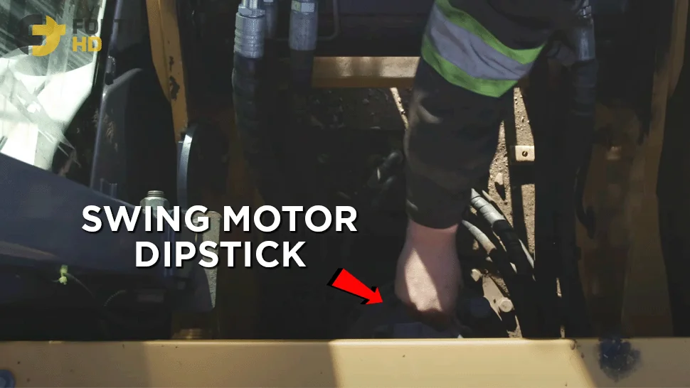 An overlay arrow shows the location of the swing motor oil dipstick on a John Deere 250G LC Excavator.