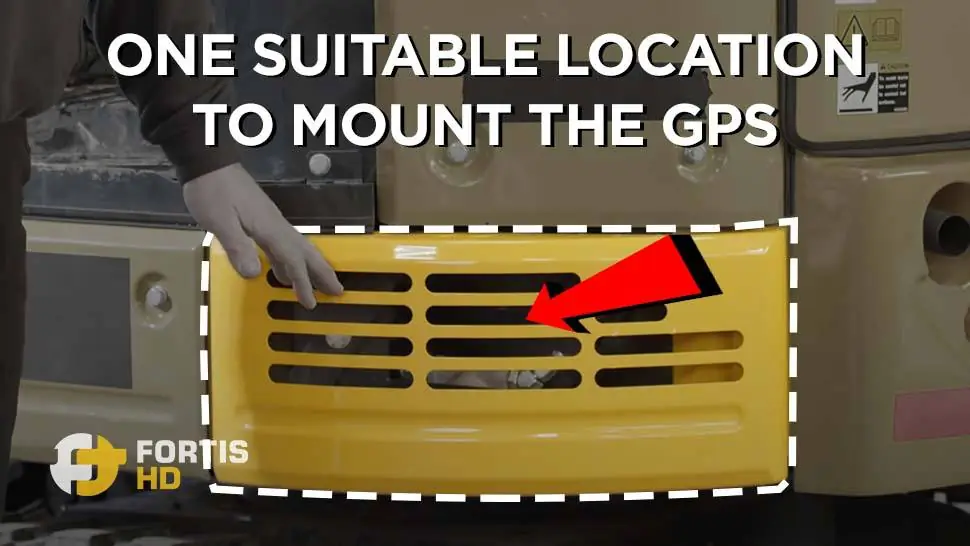 An arrow points at a suitable location to install a GPS tracker on a John Deer 26G.