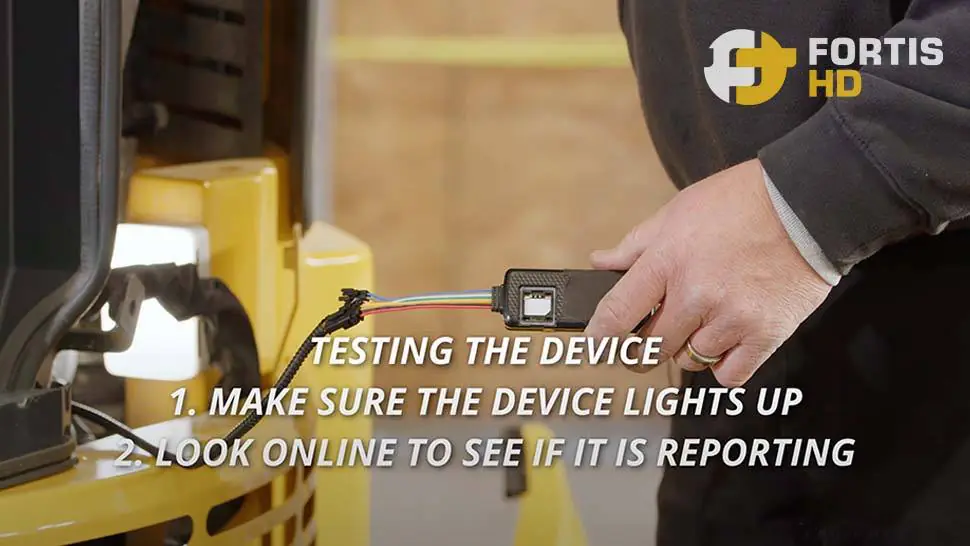 A heavy equipment operator tests a GPS tracker for the first time.
